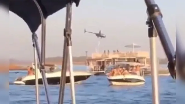 Imagem ilustrativa da notícia Helicóptero cai após manobras arriscadas e três ocupantes morrem ao afundar em lago; veja vídeo
