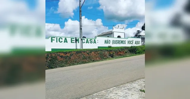 Imagem ilustrativa da notícia Pintura em muro de cemitério alerta população para ficar em casa
