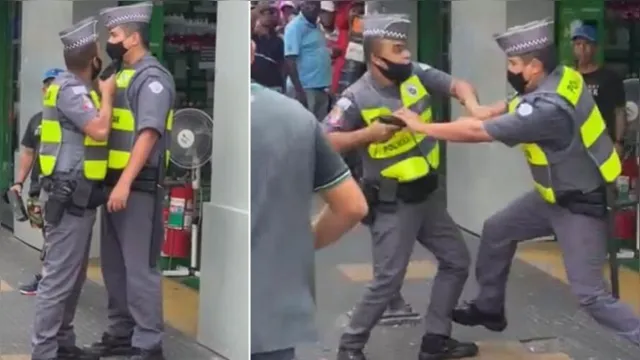 Imagem ilustrativa da notícia Vídeo: PMs brigam entre si em plena rua e militar aponta arma para colega