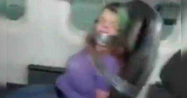 Imagem ilustrativa da notícia Vídeo: mulher é amarrada após tentar abrir porta de avião
