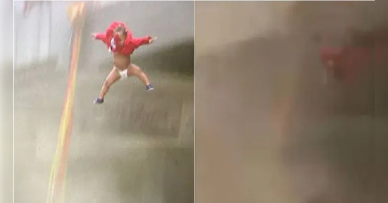 Imagem ilustrativa da notícia Vídeo: mãe joga bebê de prédio em chamas para salvá-lo