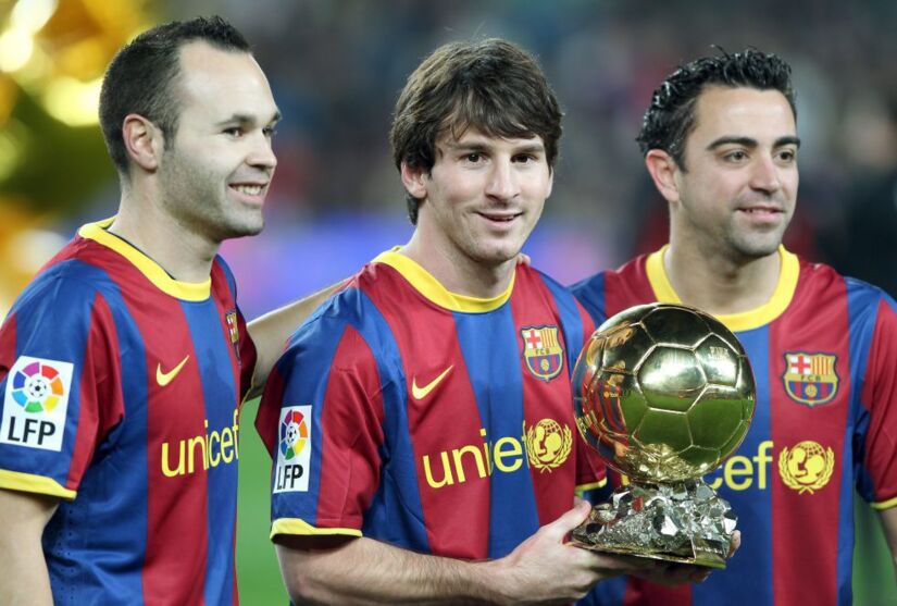 Iniesta, Messi e Xavi
