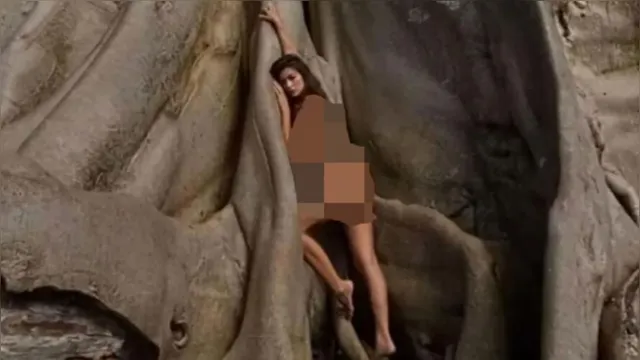 Imagem ilustrativa da notícia Modelo pode ser presa por posar sem roupa em árvore sagrada