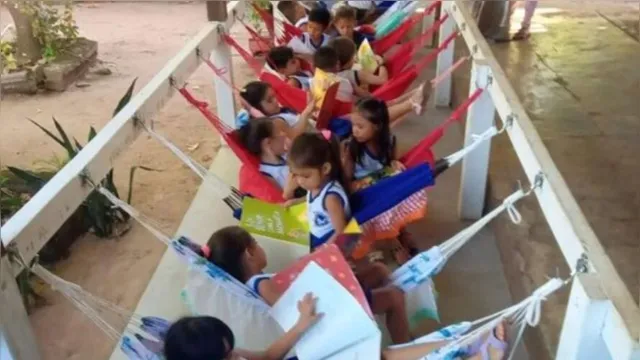Imagem ilustrativa da notícia Foto
de crianças lendo em redes no Pará viraliza na internet