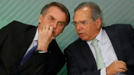 O presidente da República, Jair Bolsonaro, e o ministro da Economia, Paulo Guedes, em evento no Palácio do Planalto.