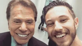 Silvio Santos e Gabriel Cartolano nos corredores do SBT