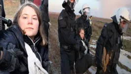 Três policias carregaram a ativista para um local distante da borda da mina