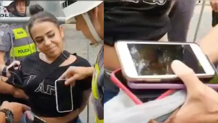 Imagem ilustrativa da notícia Vídeo: Mulher presa com 13 celulares na calça debocha da PM