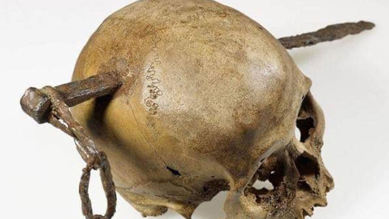 Skull with a jagged iron stake found in the United Kingdom