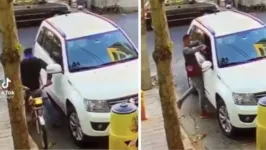 Motorista sendo abordado pelo criminosos após o golpe do retrovisor