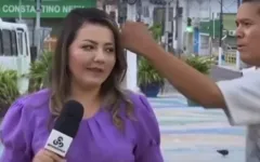 Repórter Naíne Carvalho, sendo agredida ao vivo