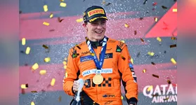 BAKU, AZERBAIJAN - SEPTEMBER 15: Race winner Oscar Piastri of Australia and McLaren celebrates on the podium during the F1 Grand Prix of Azerbaijan at Baku City Circuit on September 15, 2024 in Baku, Azerbaijan. (Photo by Dan Mullan/Getty Images)