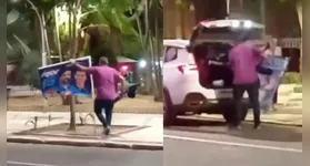 Momento em que o homem retira a bandeira do candidato