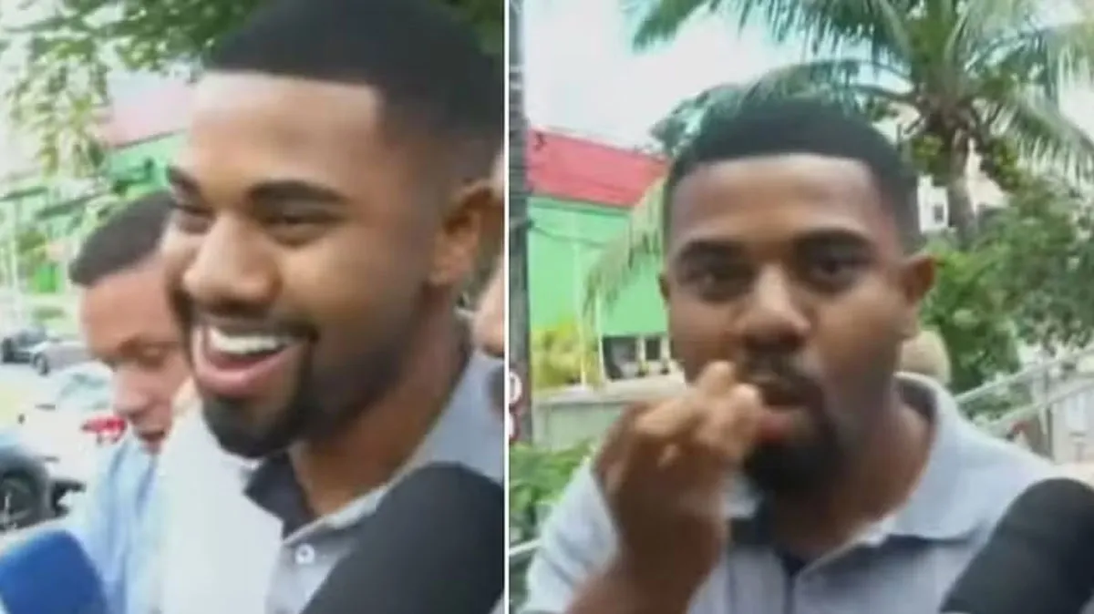 Davi Brito riu para a imprensa enquanto comia pipoca após depor sobre ameaçar a ex-namorada com uma arma de fogo.