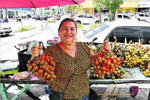 Ivone Xavier conta que tem um segredo para preparar as pupunhas que vende na feira da Pedreira.