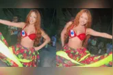 Ruivinha de Marte dança carimbó em Alter do Chão com figurino típico e bandeira do Pará no peito.