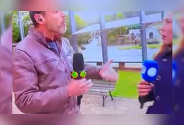 Nas imagens não é possível ver, mas a repórter da Record declarou que o jornalista do Band a empurrou