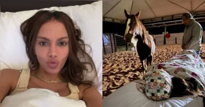Anitta deitada em maca ao lado de dois cavalos durante retiro de cura interior em haras de Minas Gerais.
