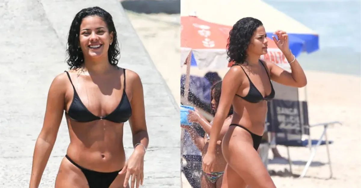De biquíni preto, Bella Campos curtiu a praia de São Conrado com amigos e chamou atenção dos banhistas pela simpatia e elegância.