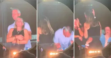 Kristin Cabot tentou se esconder das câmeras quando foi flagrada dançando nos braços do chefe durante show do Coldplay nos EUA.