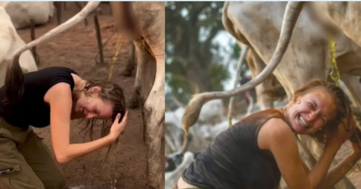 Julianna Jacewicz durante experiência com o povo Mundari, no Sudão do Sul, ao participar de ritual tradicional com uso de urina de vaca.