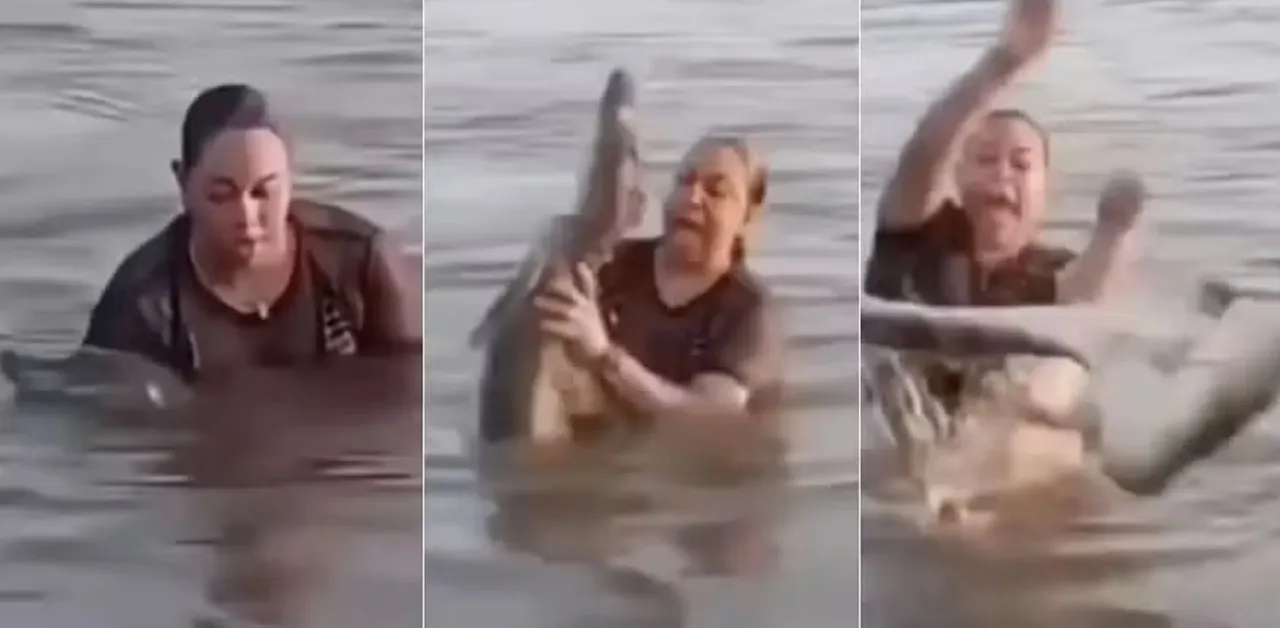 Mulher segura 'pedaço de tronco' em lagoa e descobre ser um jacaré.