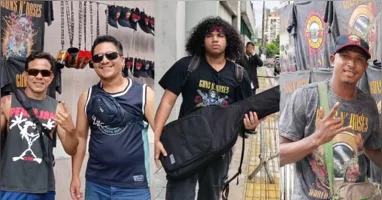 Fãs se concentram em frente a hotel na Avenida Presidente Vargas, em Belém, à espera de integrantes do Guns N’ Roses, mesmo sob chuva.