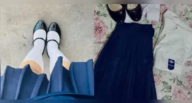 O tradicional uniforme feminino de saia azul-marinho, modelo que marcou gerações na instituição