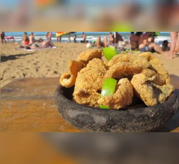 Imagem ilustrativa da imagem Férias na praia: médicos explicam como evitar infecções e intoxicação