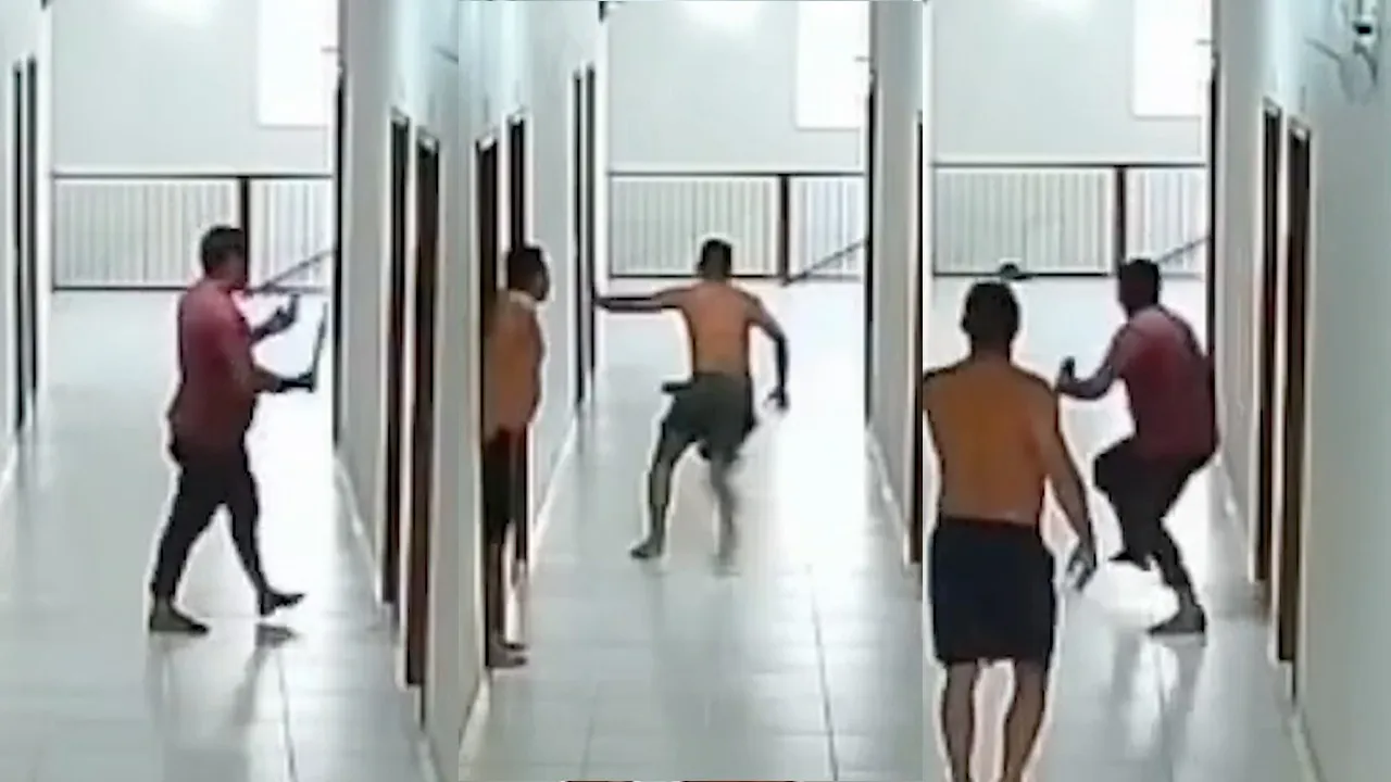 Um dos homens aparecer armado com um facão.
