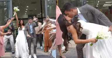 Depois da formalização do casamento, o casal recebeu a tradicional chuva de arroz dos convidados e trocou um beijo longo na saída, em celebração ao novo status.