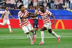 Soccer Football - FIFA World Cup 2026 - Group D - United States v Paraguay - Los Angeles Stadium, Inglewood, California, U.S. - June 12, 2026 Folarin Balogun of the U.S. celebrates scoring their second goal with Weston McKennie REUTERS/Matthew Childs