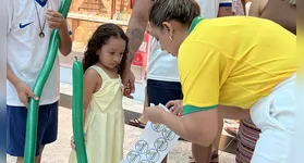 Flávia Marçal durante ação de orientação e conscientização, realizada no último jogo do Brasil na Copa do Mundo.