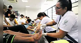 Voluntários reforçam acolhimento dos devotos que participam das procissões do Círio de Nazaré.