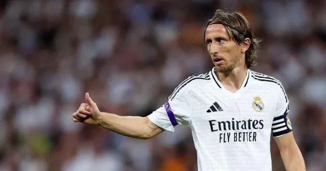 Imagem ilustrativa da notícia: Modric fecha com o Milan e 'chega com fome de título'