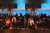 Momento em que convidados deixam o auditório em protesto durante o discurso do premiê alemão Friedrich Merz, após declarações polêmicas sobre migrantes e “paisagem urbana”.