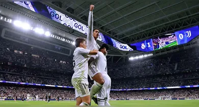 Imagem ilustrativa da notícia: Vini Jr. ajuda a furar retranca e Real vence a Juventus