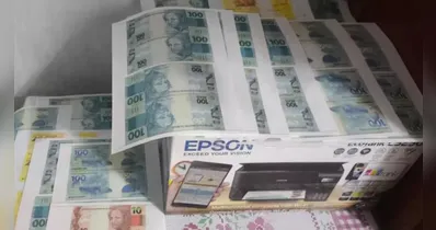 Impressora e dinheiro falso apreendido pela PC