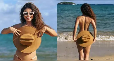 Imagem ilustrativa da notícia: Paula Fernandes tapa seios e bumbum com chapéu em fotos na praia