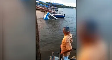 Imagem ilustrativa da notícia: Vídeo: ônibus sem freio cai no rio e passageiros fogem por janelas