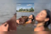 A influenciadora paraense Lia Mendonça viralizou ao compartilhar momentos de carinho com uma capivara, incluindo abraço, mergulho e até um "selinho".