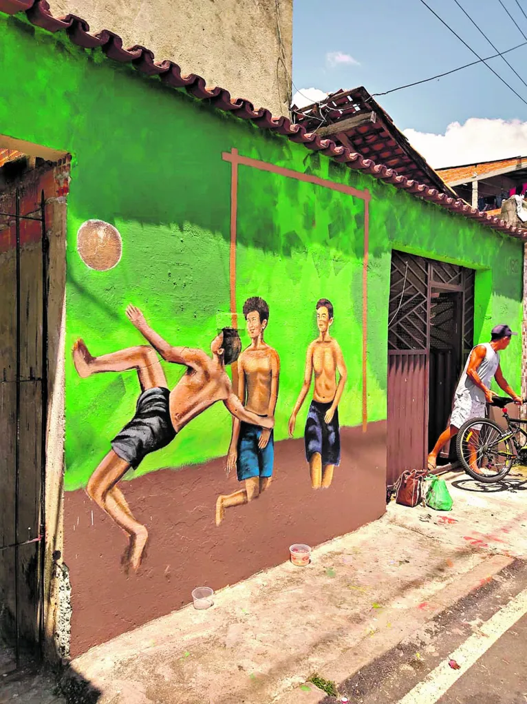 Muralismo -pintura dos muros das casas, escolas, centros comunitários e outros estabelecimentos que fazem parte do bairro