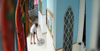 Imagem ilustrativa da notícia Vídeo: mulher é flagrada jogando fezes em altar de igreja